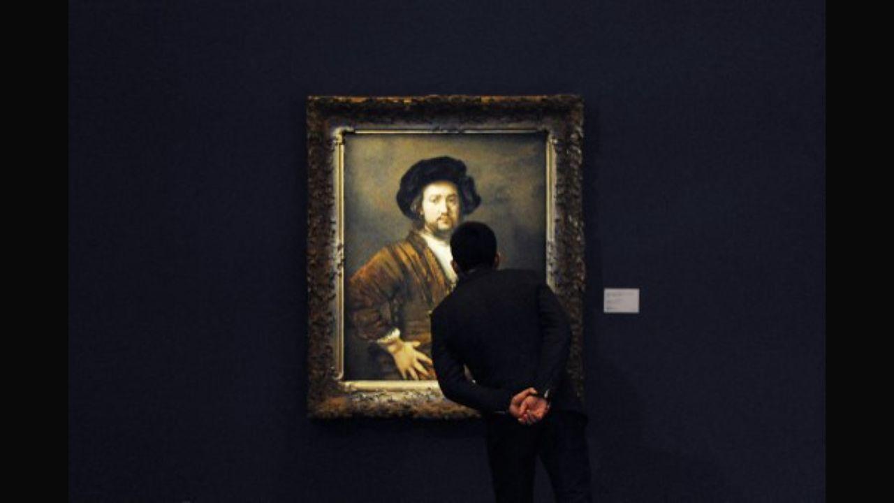 A man looks at Rembrandt's ‘Portrait of a Man With Arms Akimbo’ at Sotheby's exhibition in Beijing in 2013. The painting was purchased by Steve Wynn at Christie's in 2009 for £20 million, one of the highest price ever paid for a Rembrandt painting. In 2011, it was purchased by Isabel and Alfred Bader who later donated the painting to the Agnes Etherington Art Centre in 2015.  Photo: AFP/ Wanf Zhao