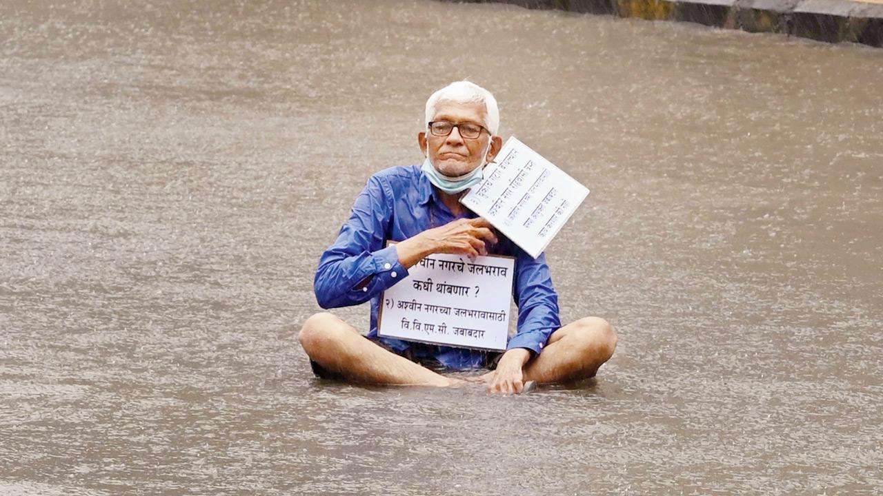 Elderly man sits for 4 hours on flooded road in protest