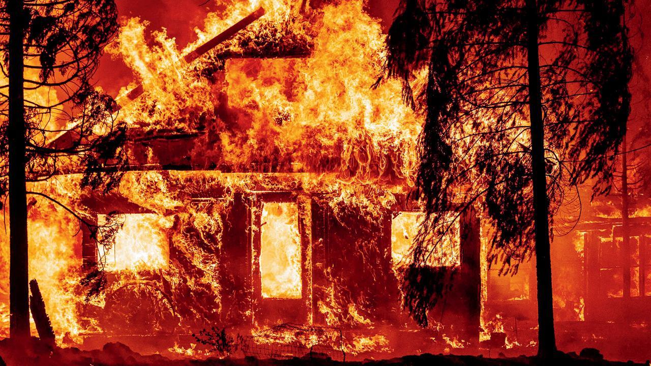 California’s largest fire torches homes as blazes lash West