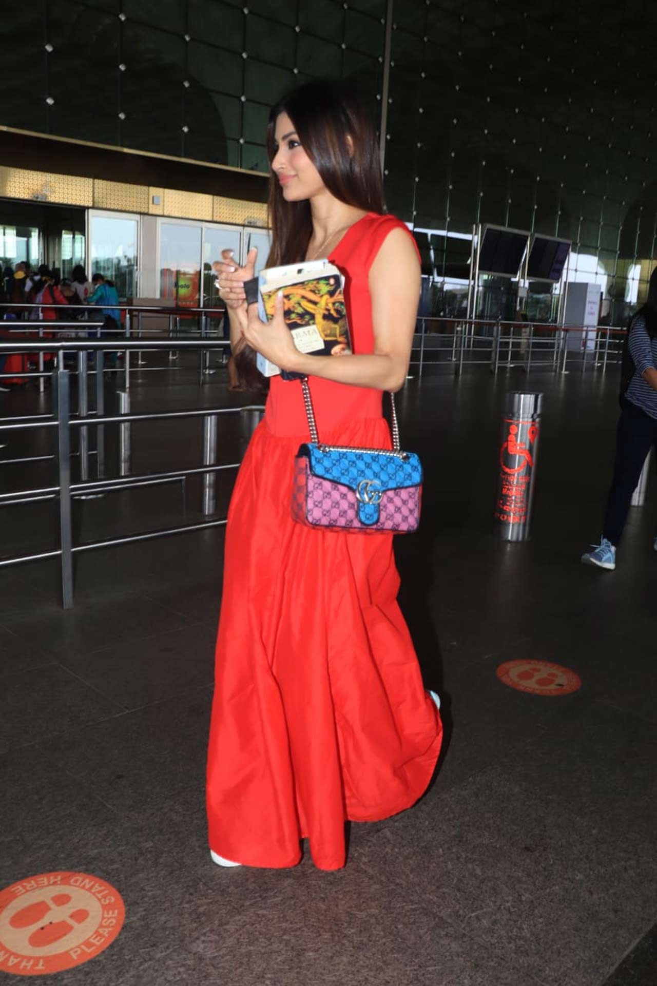 Mouni Roy was snapped wearing a red maxi dress at the Mumbai airport. She was in Dubai last year and wasn’t able to travel back to India due to the lockdown restrictions.