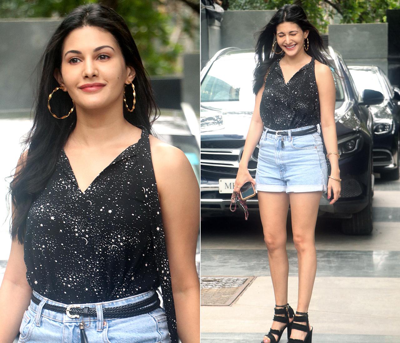 Amyra Dastur was also snapped outside Pooja Entertainment office in Juhu, Mumbai. The actress looked stunning in a black top and blue denim shorts.
