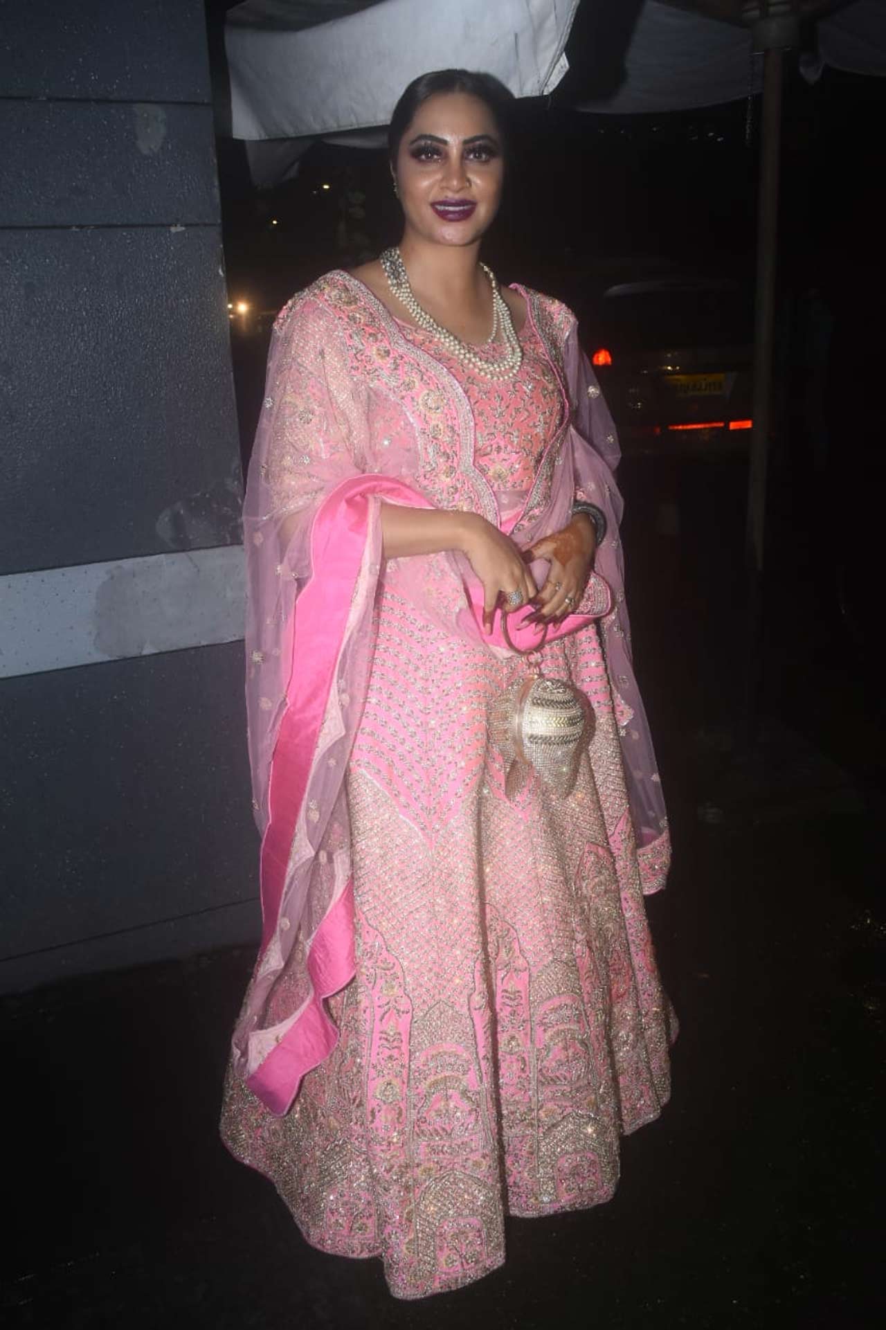 Arshi Khan's powder pink ensemble, paired with darker shades of makeup proved to be a damper as she attended Rahul Vaidya and Disha Parmar's sangeet ceremony.