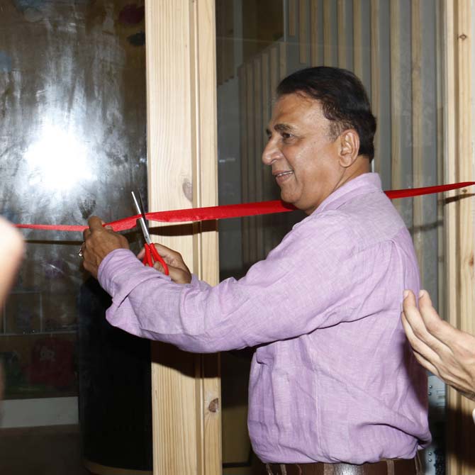 Sunil Gavaskar cuts the ribbon during the opening ceremony for a pre-school and daycare centre in Andheri