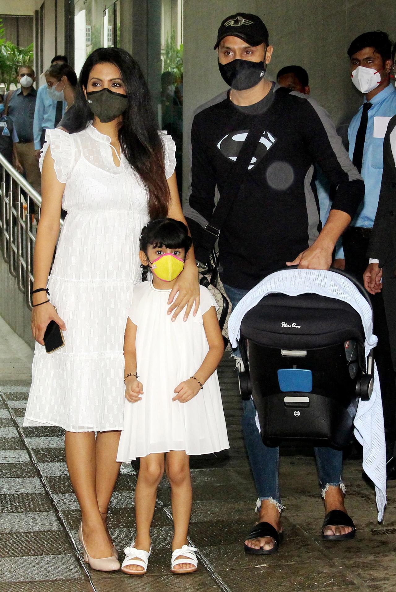 Geeta Basra and her husband-cricketer Harbhajan Singh were photographed with their newborn baby boy, as they made their way home on Wednesday afternoon. The couple's daughter, Hinaya Heer Plaha was also snapped. The couple was blessed with their second child on July 10.
