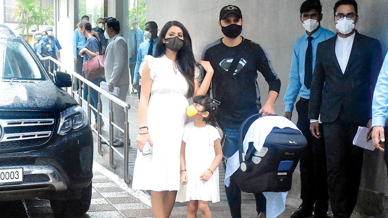 Photo: Harbhajan Singh and Geeta Basra with their newborn son at a hospital in Khar