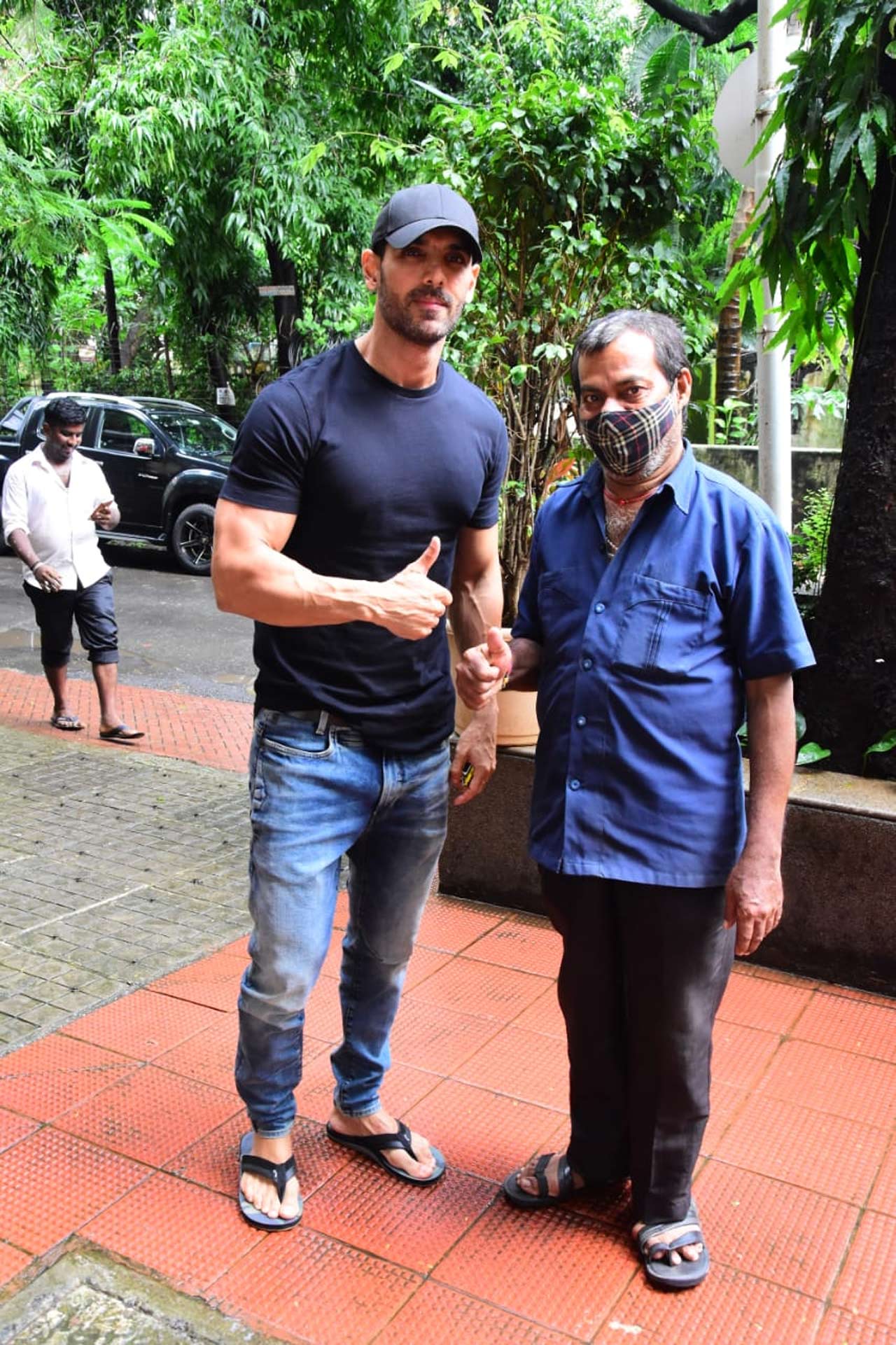 John Abraham posed with a fan when snapped near his gym in Bandra, Mumbai.