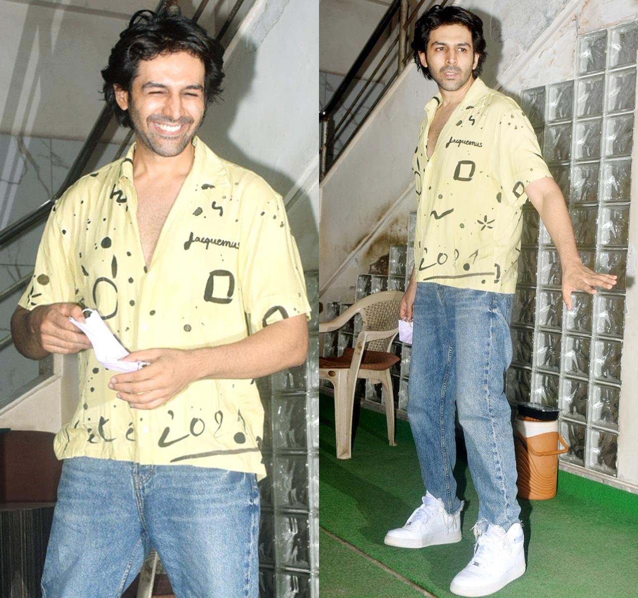 Kartik Aaryan was spotted in Andheri, Mumbai. The actor, dressed in a casual yellow shirt, paired with blue jeans and white shoes, was all smiles for the paparazzi.