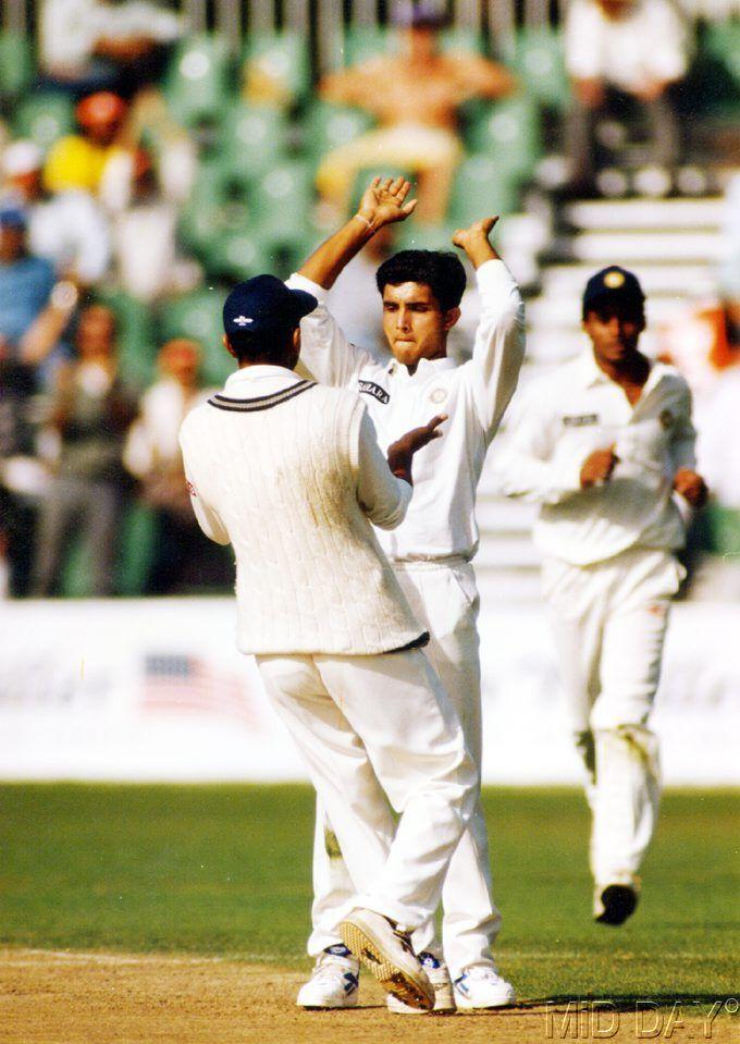 In picture: An ecstatic Sourav Ganguly always brought in his teammates to celebrate along with him once a wicket fell.
