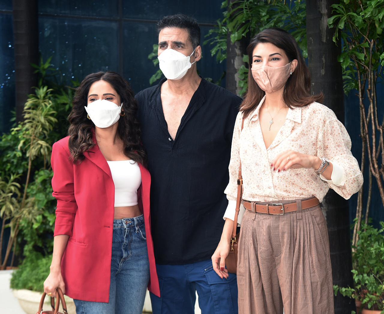 Nushrratt looked chic in a red blazer, teamed up with a white crop top and blue jeans. Akshay opted for a black short kurta and blue cargo pants, while Jacqueline was dressed in a semi-formal outfit. The trio posed for the paparazzi before the event.