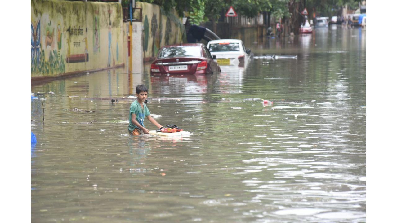 Mumbai Rains: Commuters walk on water-logged roads, trains halted, traffic hit