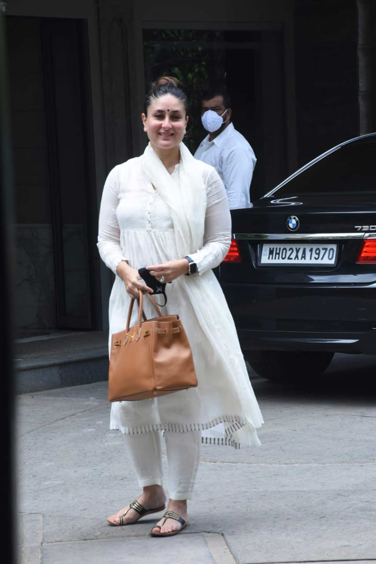 Kareena Kapoor Khan was spotted in a traditional avatar at her father Randhir Kapoor's new residence at Bandra. The actress slayed her look and flashed her smile as she posed for the flashbulbs. She's now gearing up for Laal Singh Chaddha and Takht. Takht will be Khan's second collaboration with Karan Johar where he directs the actress. This period drama, which was slated to release on December 24, 2021, has now been postponed. It also stars Anil Kapoor, Ranveer Singh, Vicky Kaushal, Alia Bhatt, Bhumi Pednekar, and Janhvi Kapoor.