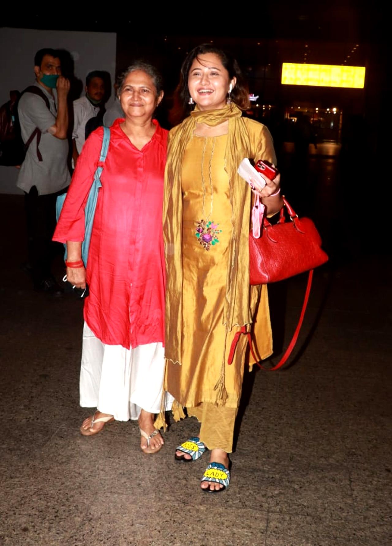Actress Rashami Desai was clicked with her mother at Mumbai airport. The actress, who is known for her shows 'Dil Se Dil Tak' and 'Uttaran', was recently seen in the music video 'Kinaa sona' with 'Bigg Boss 14' runner-up singer Rahul Vaidya. She is also part of the web series 'Tandoor', whose trailer was dropped on Monday. She plays the role of an aspiring politician who marries her lover secretly in the series. She shares the screen with actor Tanuj Virwani in the series helmed by Nivedita Basu.