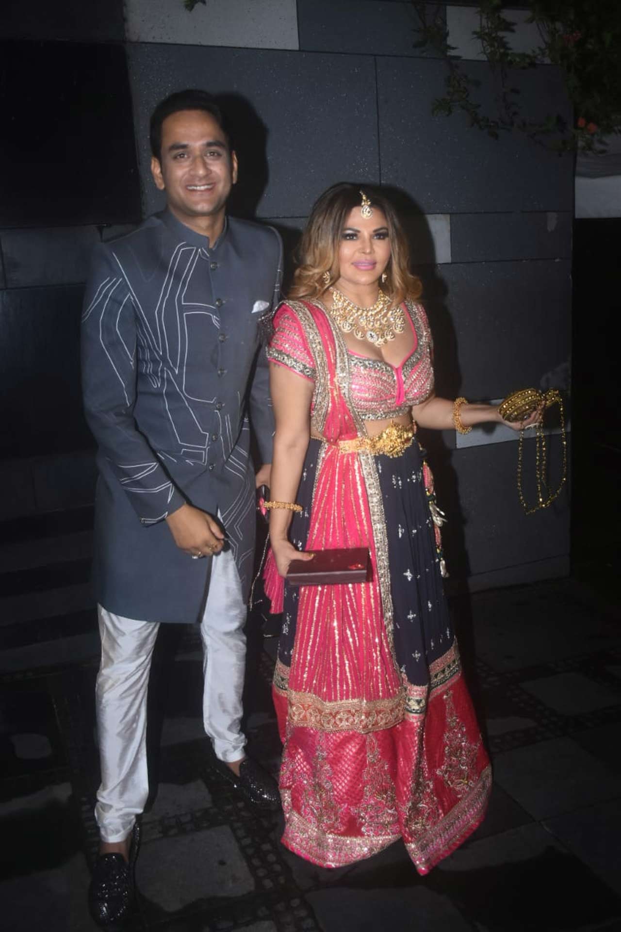 Rakhi Sawant and Vikas Gupta posed for the paparazzi as they attended the ceremony together. While Vikas kept it chic in a grey sherwani, Rakhi's colourful choice of lehenga grabbed eyeballs.