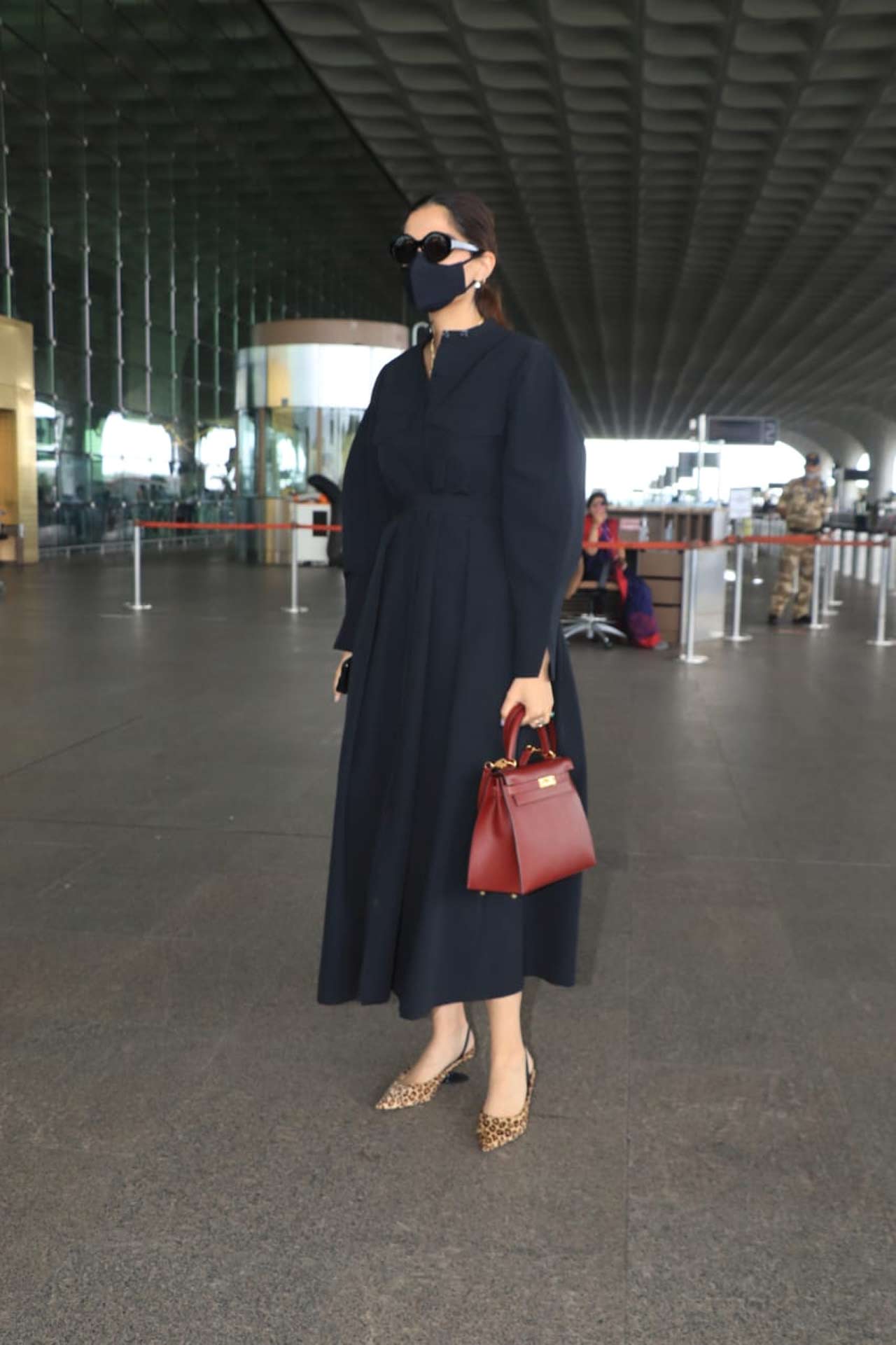 Sonam Kapoor, who returned from London, was snapped showing off her chic side in a black outfit at the Mumbai airport.