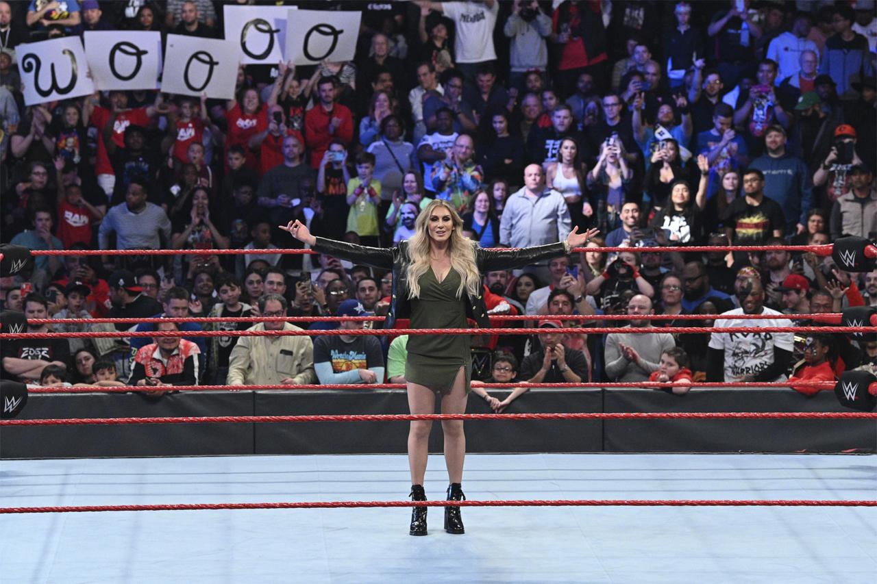 WWE Superstar Charlotte Flair acknowledges the WWE Universe as she stands in the heart of the WWE ring.