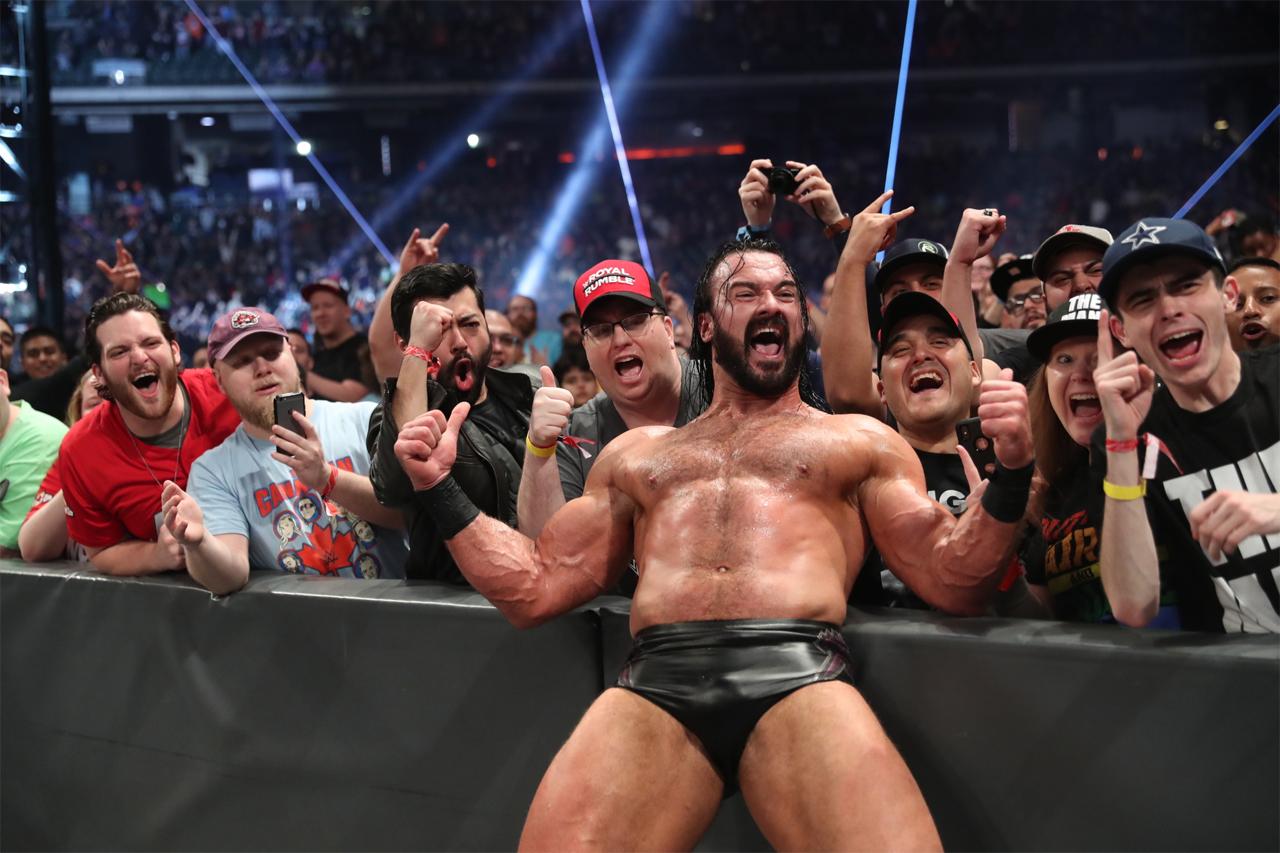 Former WWE champion Drew McIntyre all charged up as he celebrates a match win along with WWE fans.