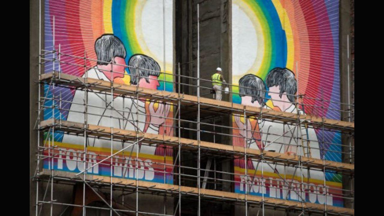 A mural by US artist Judy Chicago entitled 'Fixing a Hole', which depicts the Beatles and was inspired by their song of the same name from the 'Sgt. Pepper's Lonely Hearts Club Band' album, is pictured on the disused White Tomkins & Courage Grain Silo in Stanley dock, Liverpool, northern England on June 1, 2017. Photo: AFP
