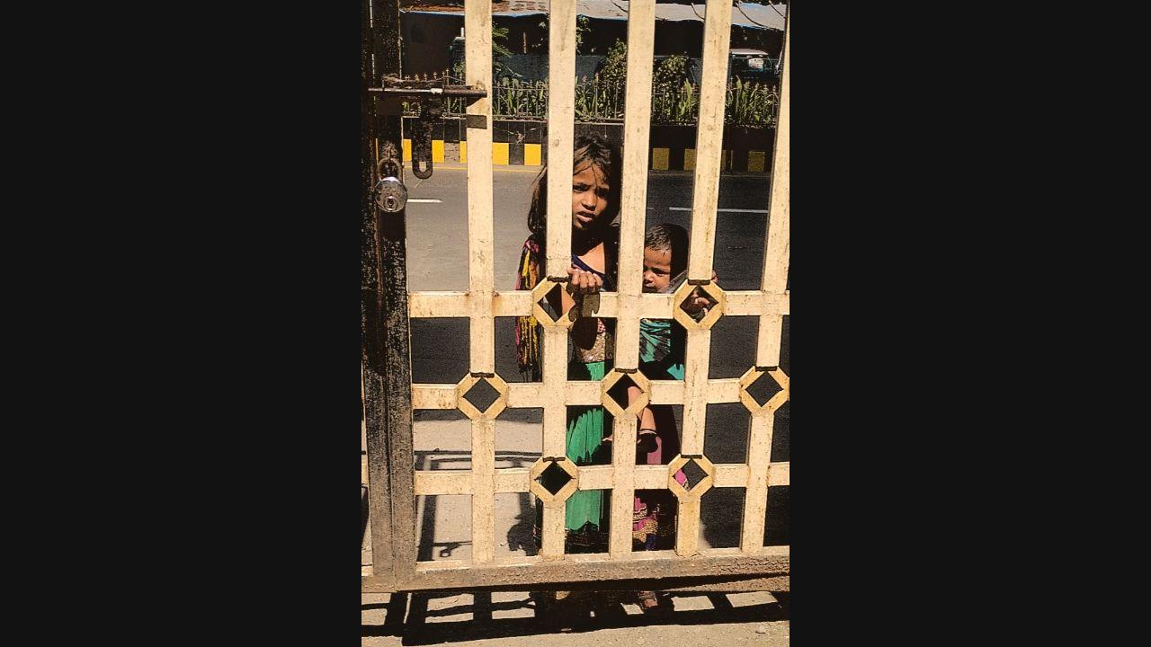 Sanskruti Mohite, a deaf student from Thane steps out to her building gate in time to see a child begging near it. Photo: Rajen Nair/Enabled Photography