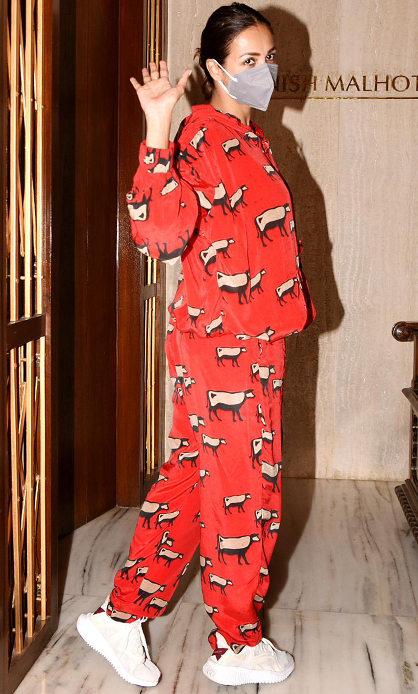 Malaika Arora, who recently got fully vaccinated, too attended the luncheon at Manish's home. Malaika's co-ord set in red seemed like the fitness diva was in a comfy mood.