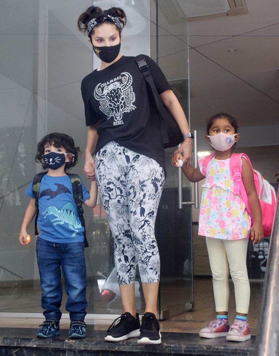 Sunny Leone was clicked at her office in Andheri. The actress kept it casual in a black printed tee, a monochrome yoga pant and bandana on her head. She was spotted with her daughter Nisha Kaur Weber and twins Asher and Noah.