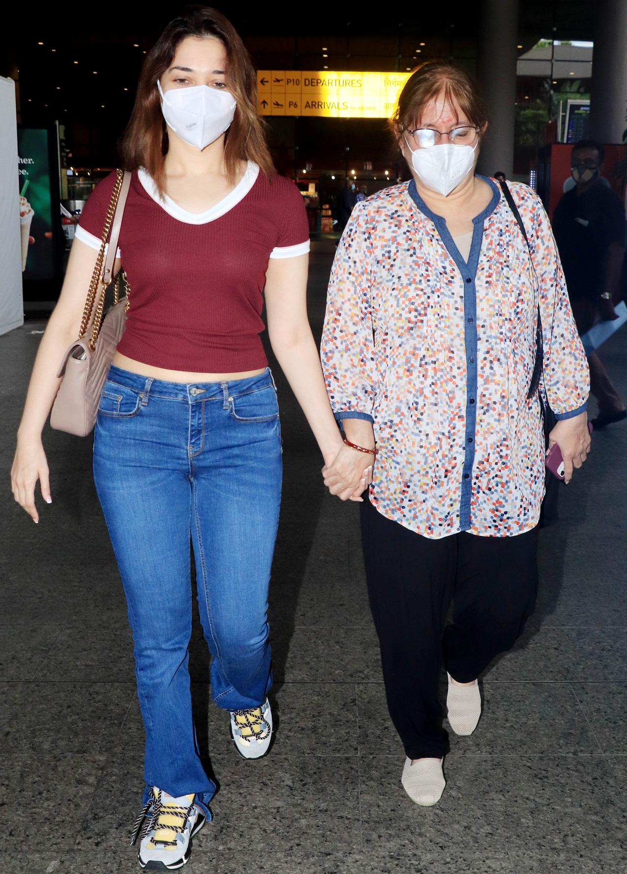 Tamannaah Bhatia along with her mother was also spotted at Mumbai airport. Tamannaah wore a maroon tee and denim as she posed for the photographers at the airport.