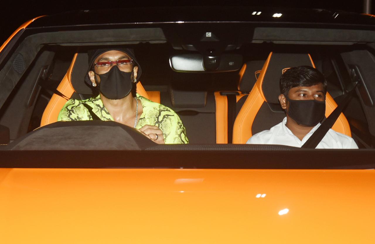 Arjun Kapoor's one of the closest buddies, Ranveer Singh was clicked arriving at the birthday bash venue in his Lamborghini. Ranveer kept it quirky and stylish as usual, as he sported a green shirt, black cap and red glasses.