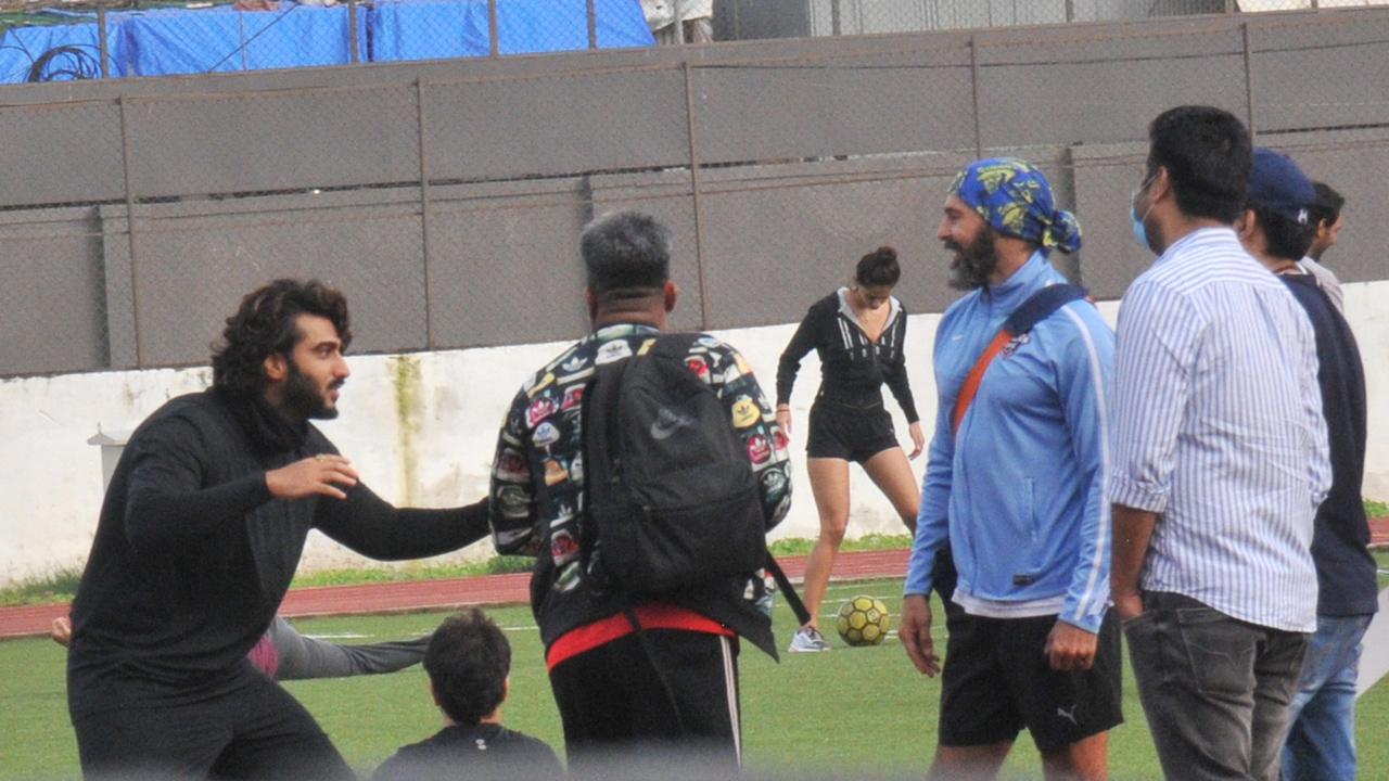 Arjun Kapoor was snapped in a candid shot while interacting with Dino Morea. Disha was seen practising the game, right behind the boys!