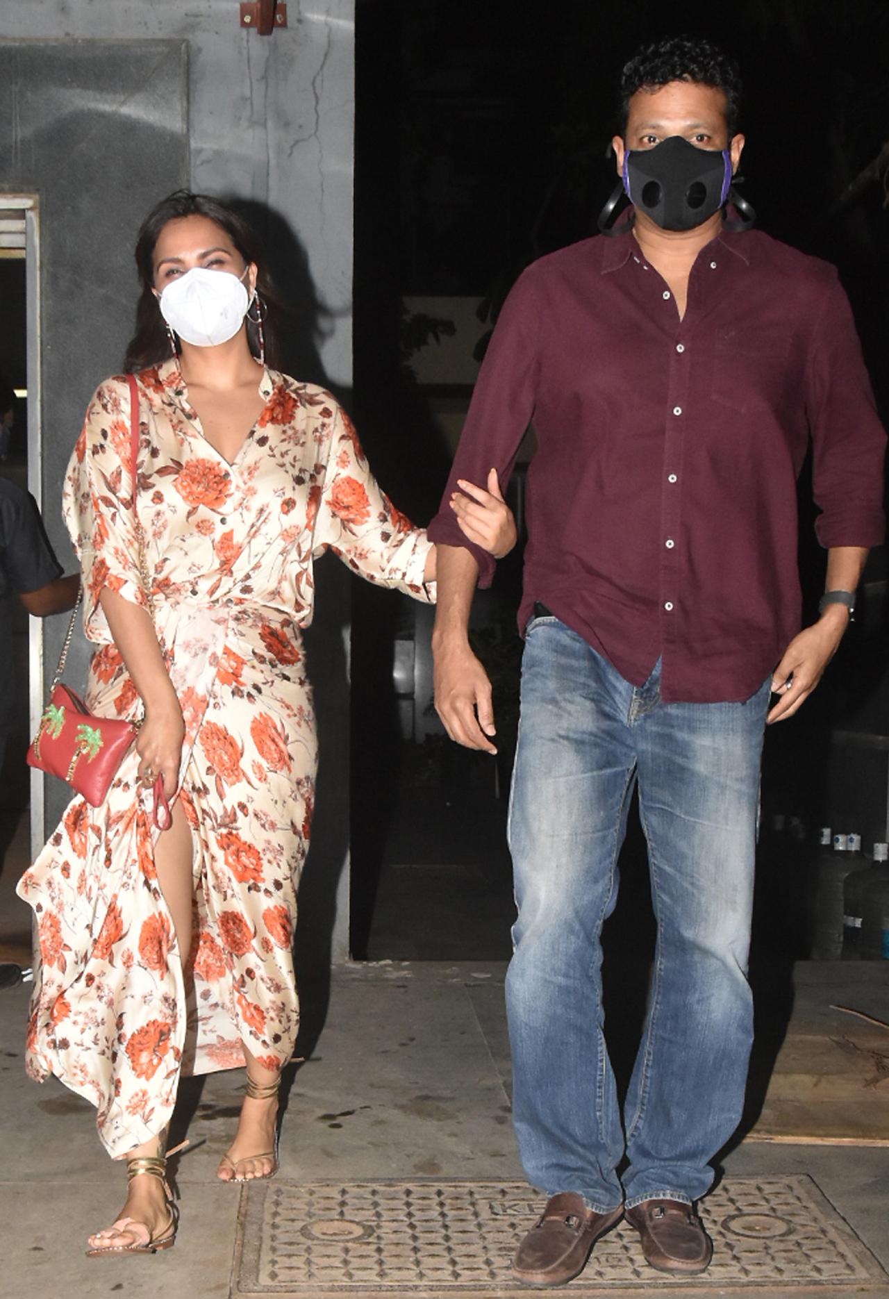 Lara Dutta attended the 'Bell Bottom' screening with husband-tennis player, Mahesh Bhupathi. Lara will essay the role of former Prime Minister Indira Gandhi in the film. The actress opted for a floral-print maxi dress, while Mahesh kept it simple in a formal shirt and blue jeans.
