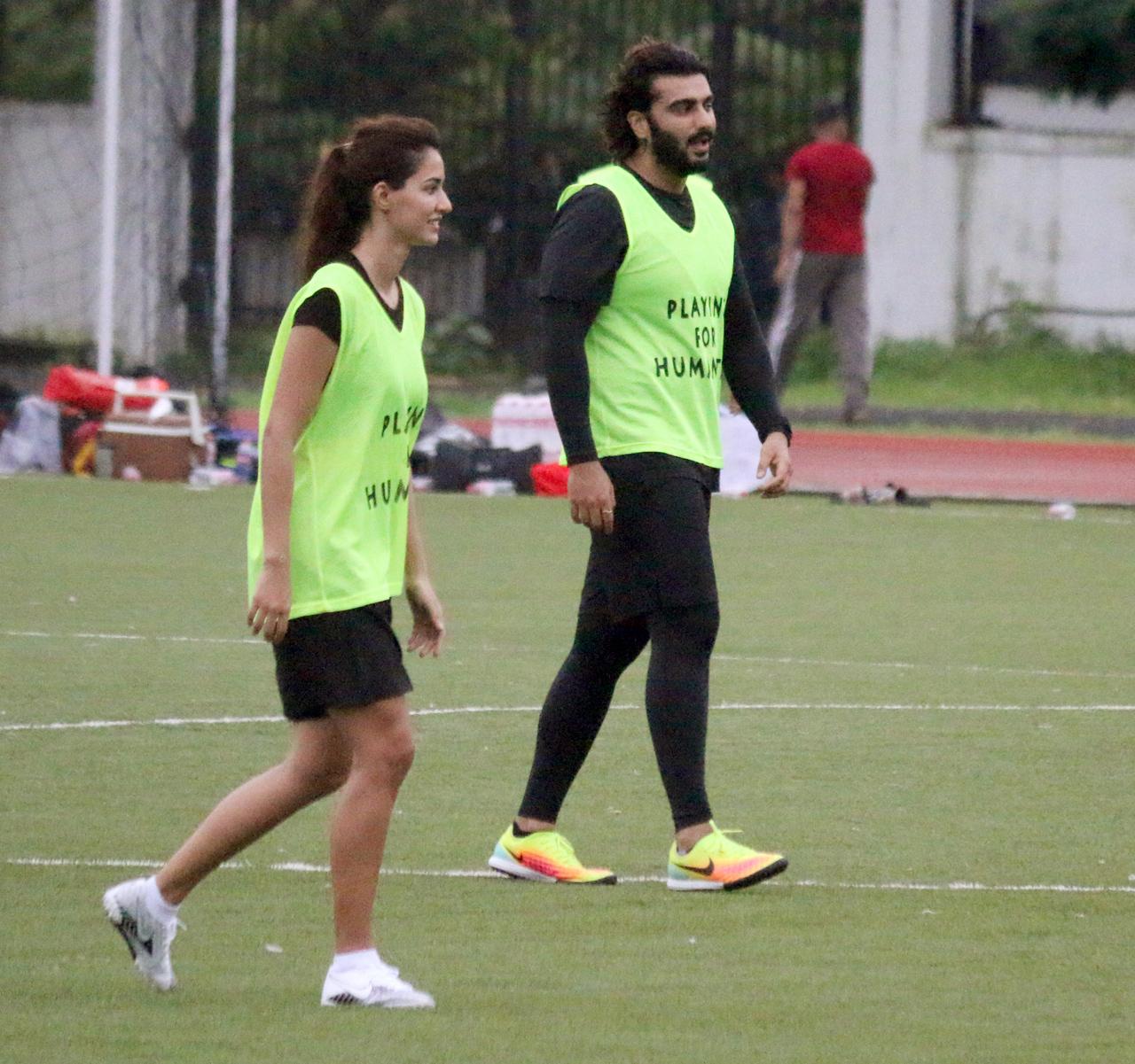 Disha Patani and Arjun Kapoor clicked on the ground, all engrossed in their game.