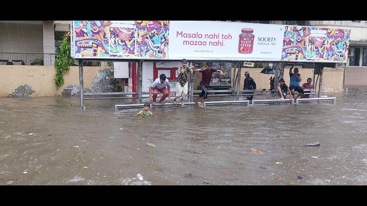Children playing in flood waters at Matunga in Mumbai. Heavy rains on Wednesday morning led to waterlogging in several low-lying areas of the city. Photo: Rajendra Aklekar