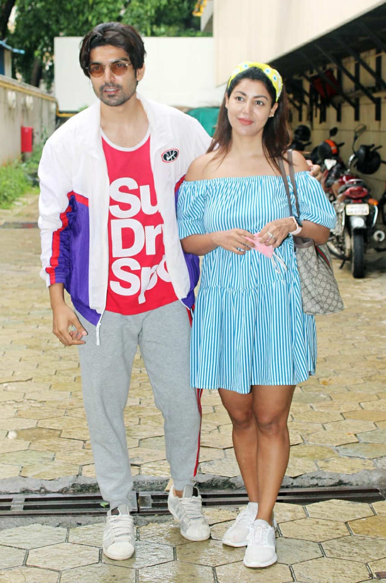 Gurmeet Choudhary was snapped with his wife Debina Bonnerjee at a popular food mall in Bandra, Mumbai. Gurmeet showed off his uber-cool look in a casual avatar and Debina's off-shoulder checkered dress looked like a perfect monsoon outfit. All pictures/Yogen Shah