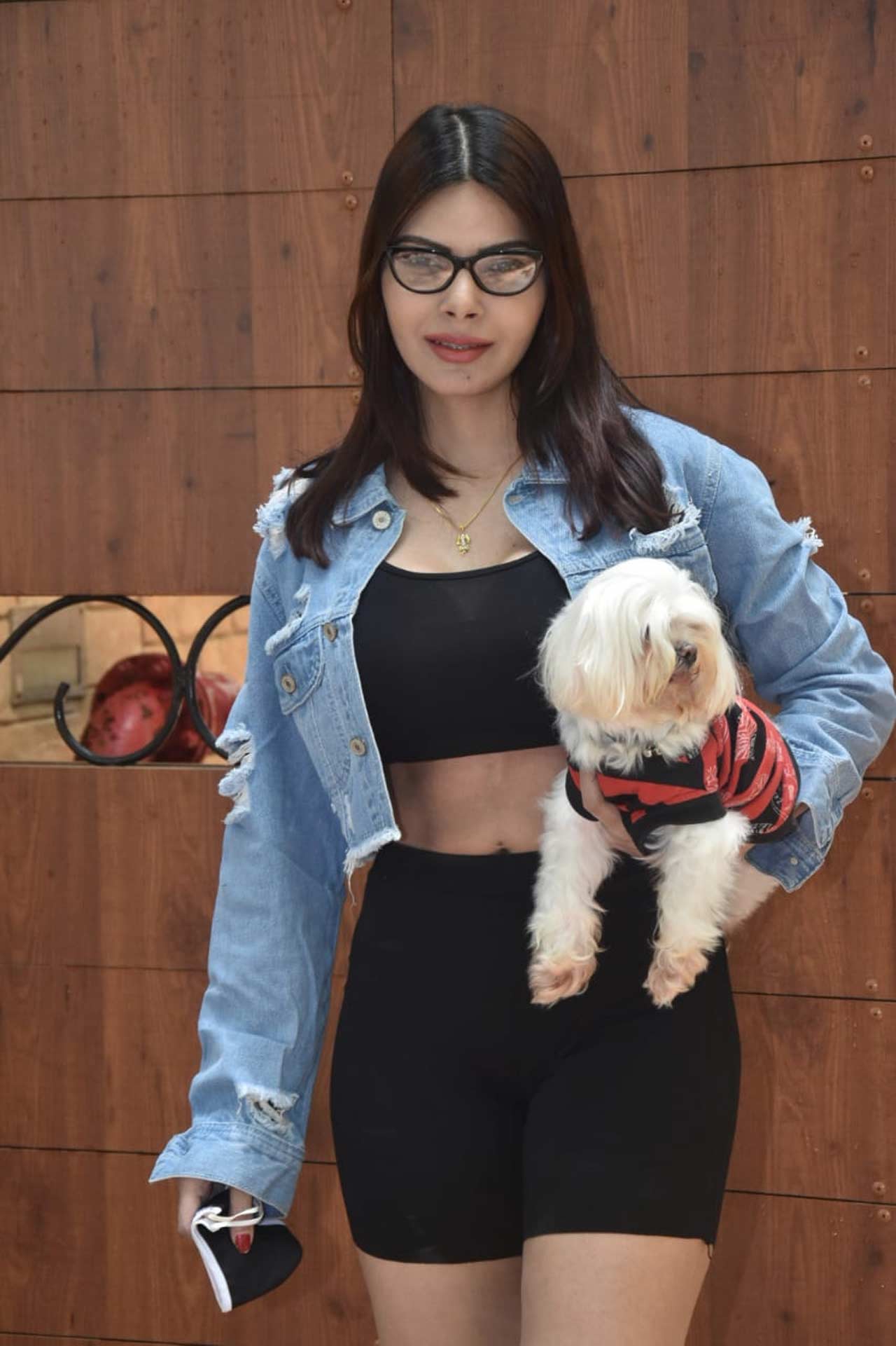 Sherlyn Chopra posed for the shutterbugs when clicked in Juhu, Mumbai. The actress was seen wearing black athleisure, paired with a denim jacket. 