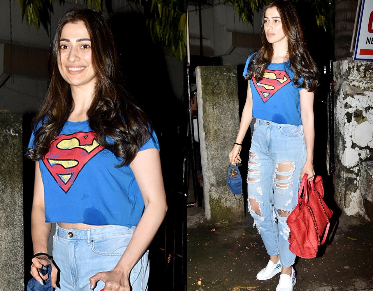 Raai Laxmi was clicked outside a salon in Juhu, Mumbai. As the unlocking process in Mumbai began on June 7, gyms, restaurants, salons, and other commercial establishments reopened in the city. The actress opted for a superman print crop top, paired with distressed jeans and while sneakers.