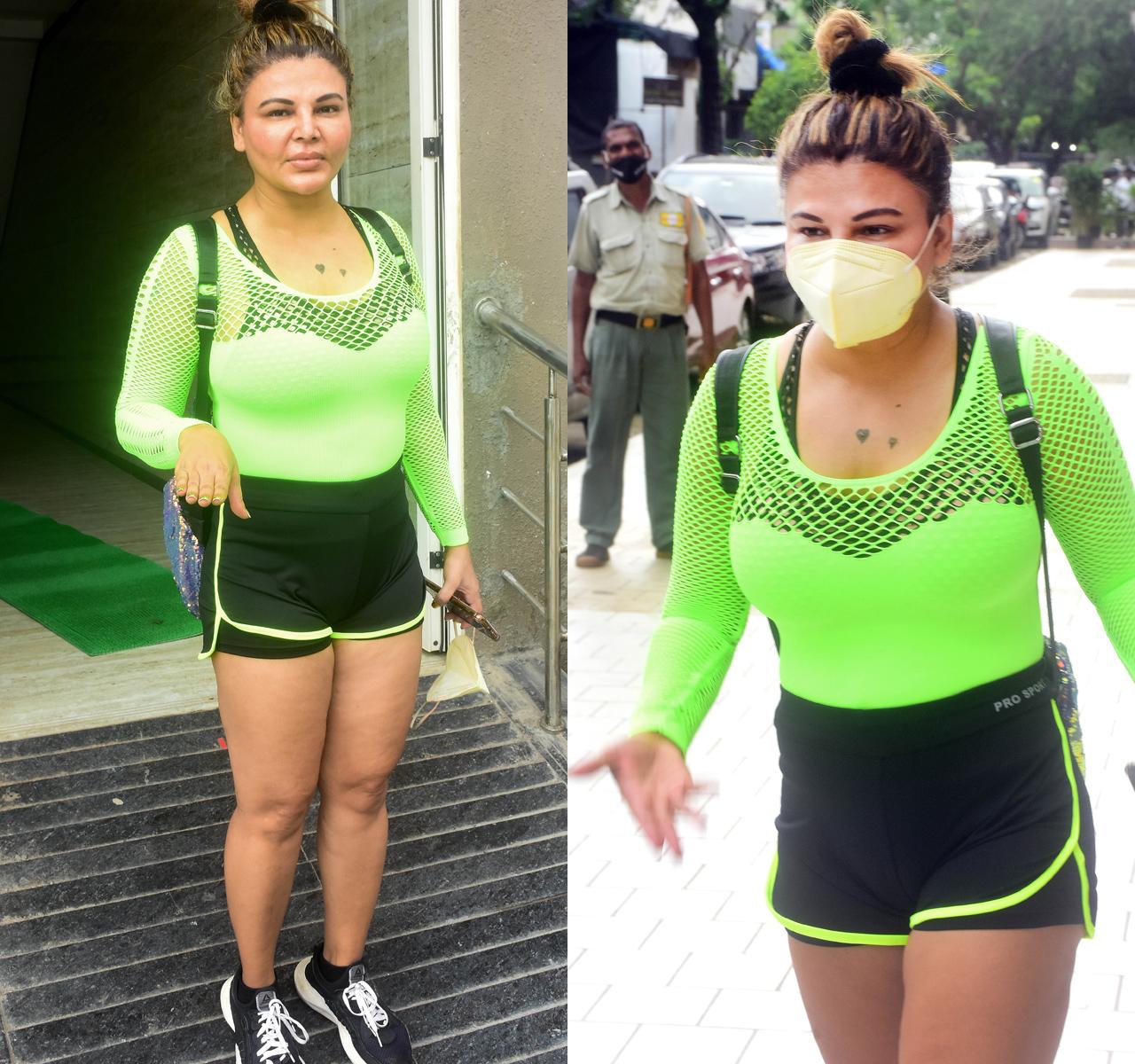 Rakhi Sawant was also snapped before hitting the gym in Andheri, Mumbai. She was seen clad in a fluorescent green mesh top, paired with black gym shorts and black shoes.