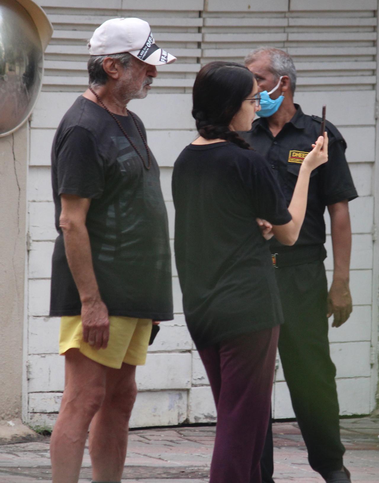 The father-daughter duo was dressed very casually. Shakti was seen in a black t-shirt and yellow shorts, while Shraddha Kapoor opted for a black t-shirt and purple track pant.