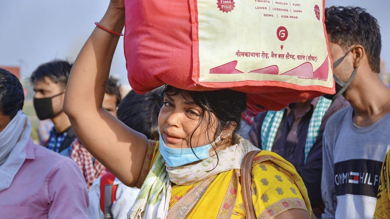 A year on, migrants struggle to get life back in order