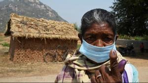 A voter shows her inked finger after casting her vote outside a polling station during Phase 1 of West Bengals legislative election in Purulia district. PicAFP