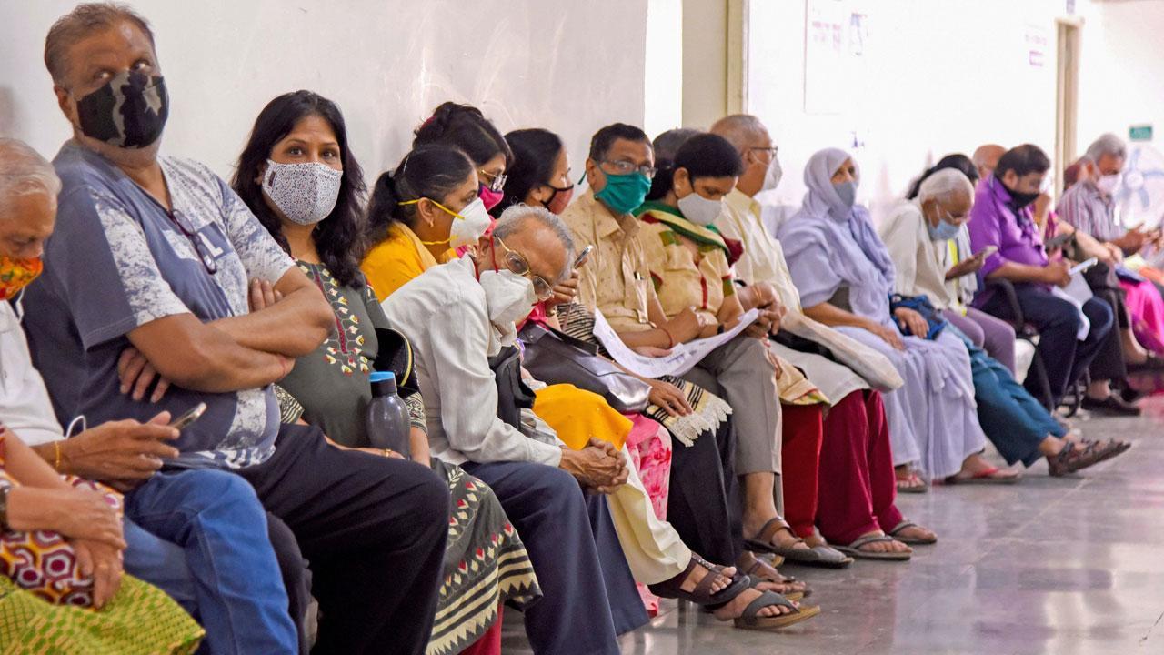 Elderly people wait to get vaccinated against CVOID-19, at Navi Mumbai Municipal Corporation (NMMC) hospital at Vashi. Pic/PTI