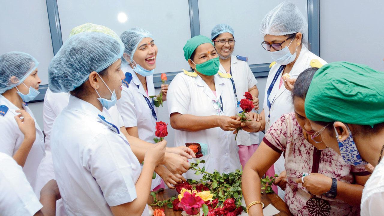 While a total of 8,092 women were vaccinated at SevenHills Hospital, BKC Jumbo Centre, Nesco Jumbo Centre, Mulund Jumbo Centre, and Dahisar Jumbo Centre on the occasion of International Women's Day, the staff at COVID-19 vaccination centre Babasaheb Ambedkar hospital, Kandivli, were seen violating social distancing norms and not wearing the masks properly. Photo/Satej Shinde