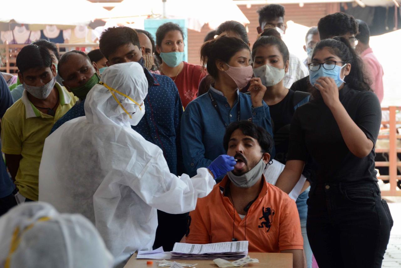 As per BMC order, rapid antigen test (RAT) will be carried out randomly at crowded places.
In picture: A health worker takes a swab sample of a man for a coronavirus test at Goregaon (Topiwala) Municipal Maternity Home, Goregaon. Photo: Satej Shinde