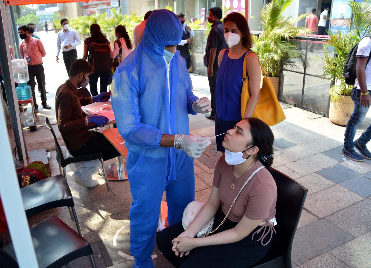 A woman undergoes COVID-19 test outside Phoenix Market City mall at Kurla. Photo: Sameer Abedi