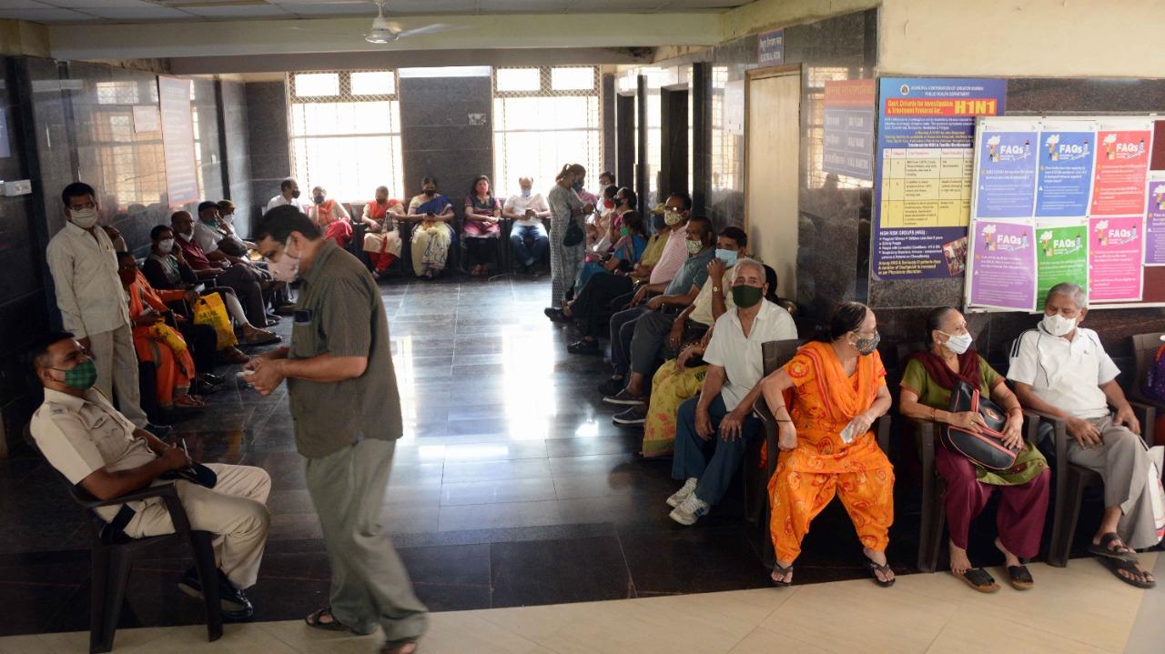 Even as Mumbai continues to witness a spike in COVID-19 cases, senior citizens were seen flouting social distancing norms as they sat in a long queue to get the jab at Babasaheb Ambedkar Municipal General Hospital, Kandivli. Photo: Satej Shinde