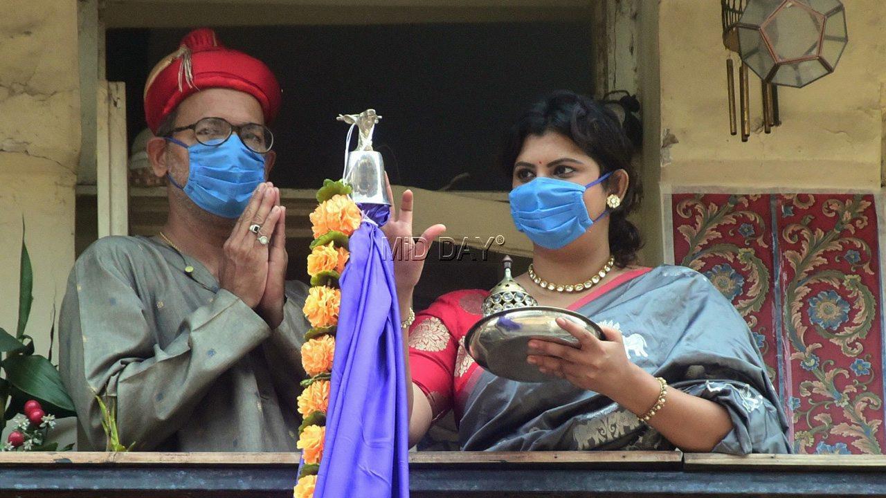 A daughter and her father were seen wearing their mask as they celebrate Gudi Padwa at their residence in Girgaon, Mumbai.