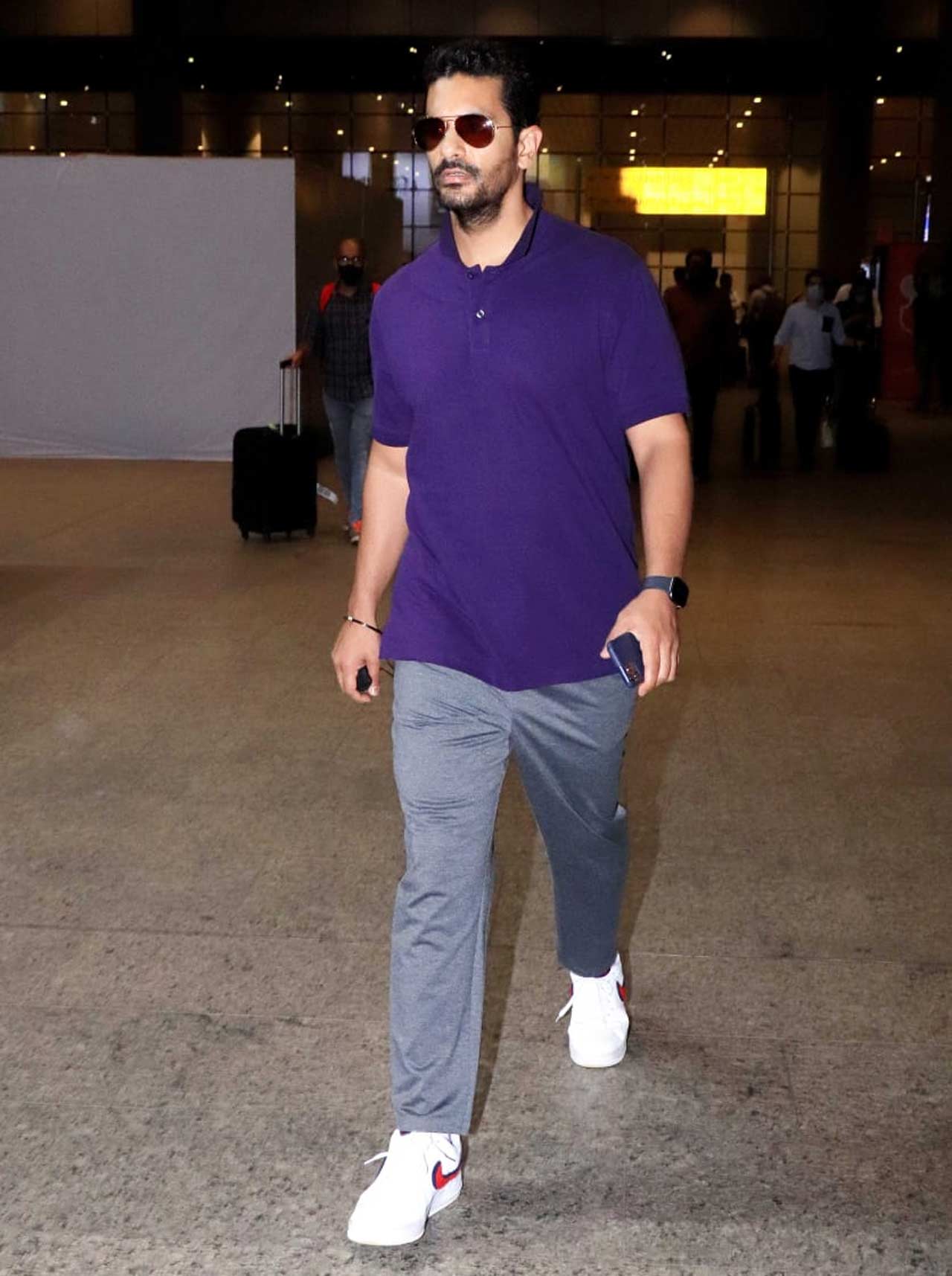 Angad Bedi opted for a purple t-shirt, paired with basic denim as his airport look. On the work front, Angad will be next seen in 83 the film.