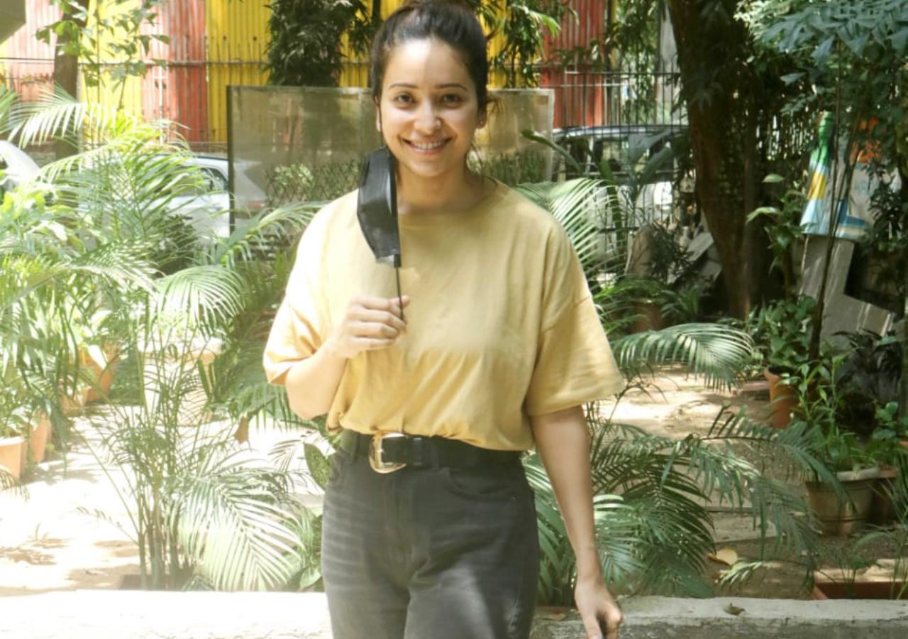 Asha Negi, who was last seen in Ludo happily posed for the photographers outside a salon in Bandra.