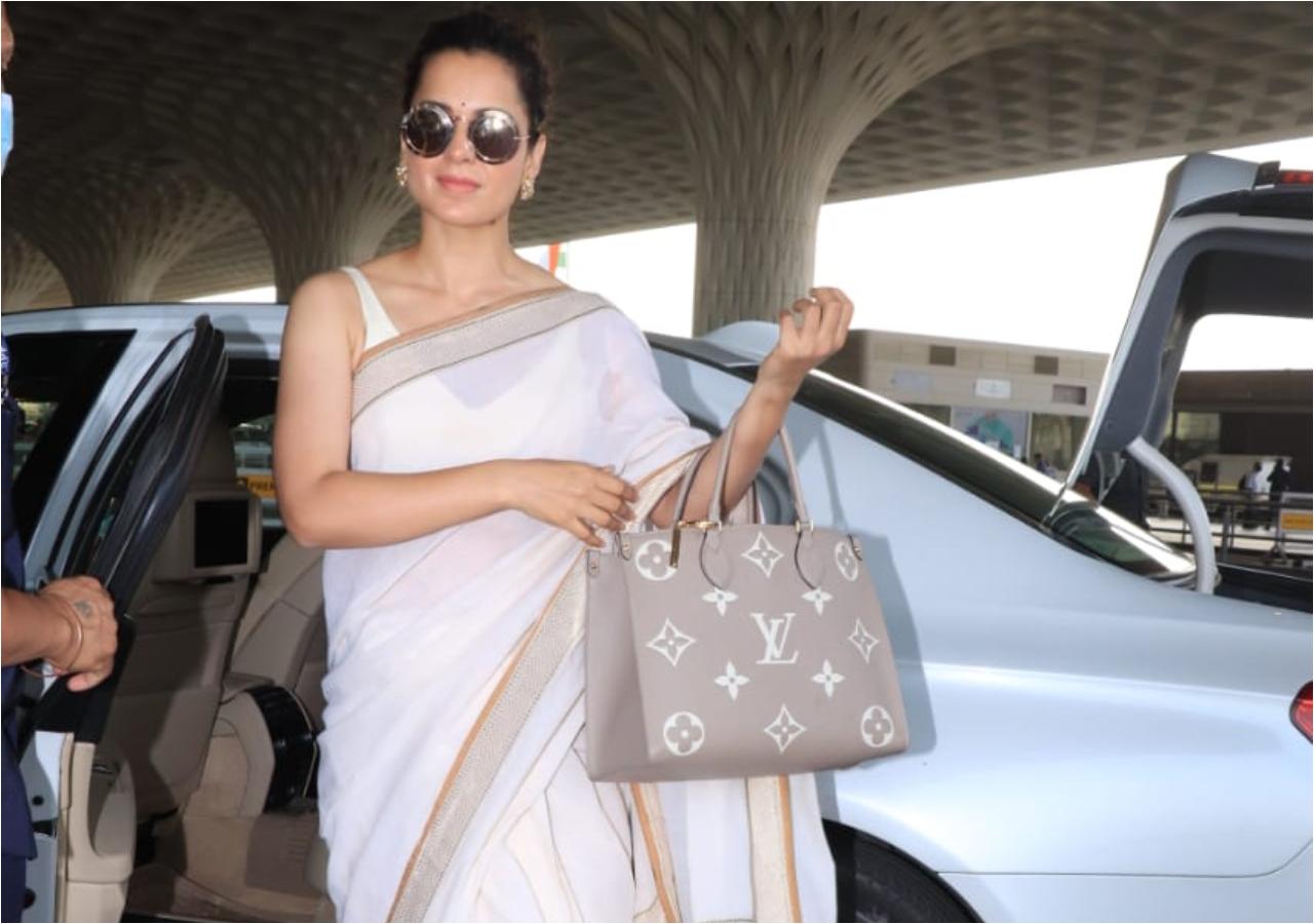 Kangana Ranaut was snapped at the Mumbai Airport wearing a gorgeous white saree as she posed for the photographers. Kangana Ranaut has won the National Film Award as Best Actress for the fourth time on Monday, for her performances in Manikarnika and Panga. (All pictures: Yogen Shah)
