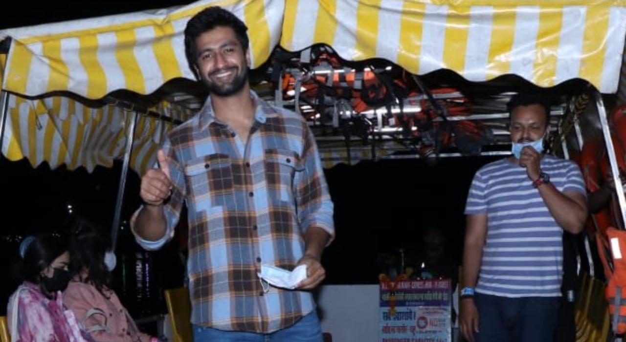 Vicky Kaushal looked happy and cheerful in his checkered shirt and denims as he posed for the photographers.