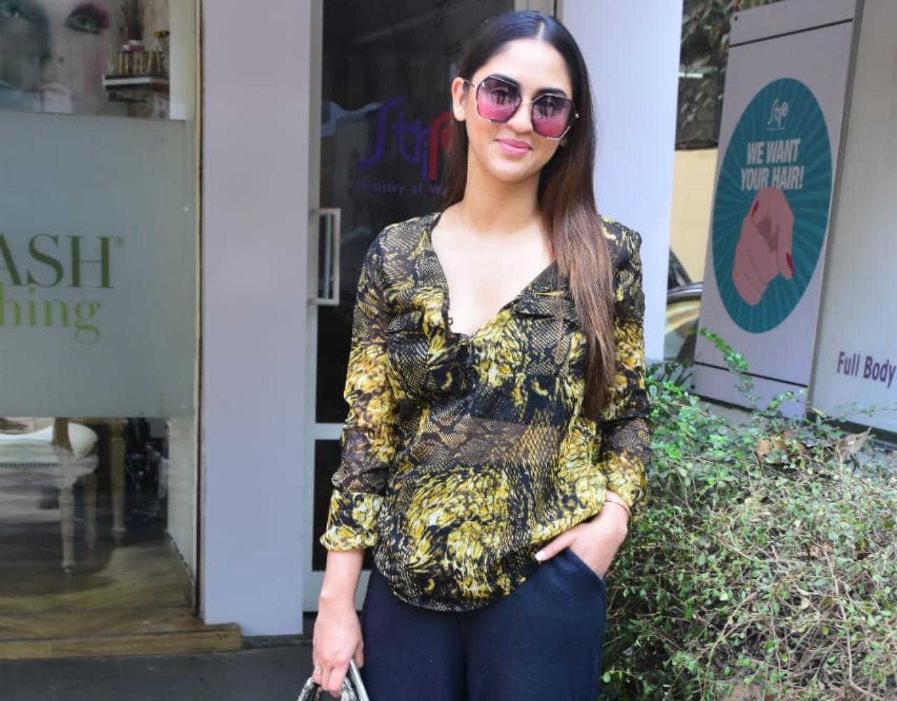 Krystle D'Souza showed off her fashion skills as she happily posed for the photographers outside a salon in Bandra. The telly star opted for a green printed top and denims for the outing.