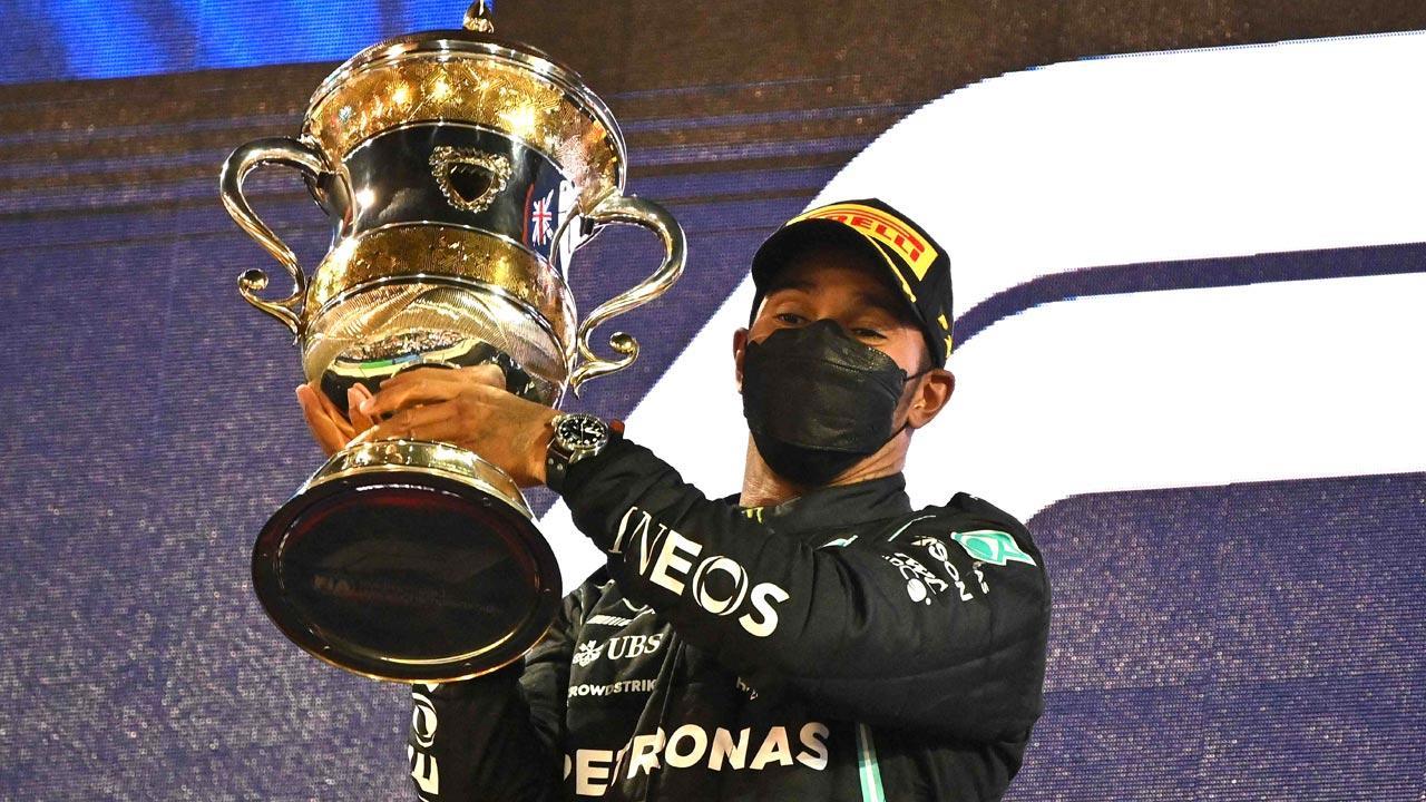 Lewis Hamilton holds off Max Verstappen to win tense F1 season-opener