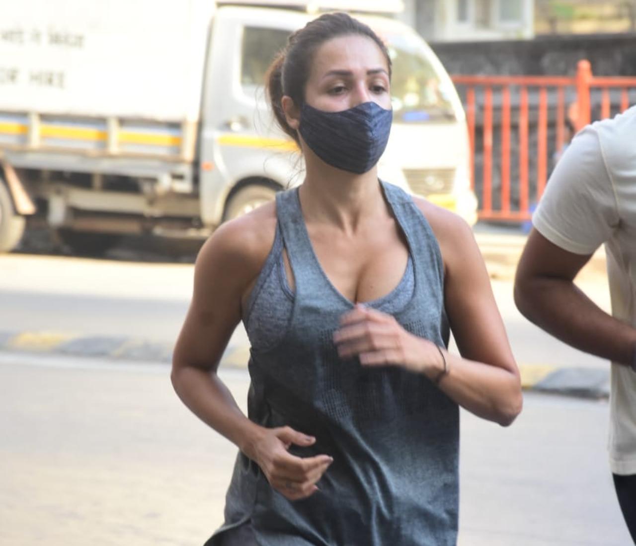 Malaika Arora had a busy day in office. In the morning, the 47-year-old diva was snapped burning her calories on the streets of Bandra, Mumbai. (All pictures: Yogen Shah).